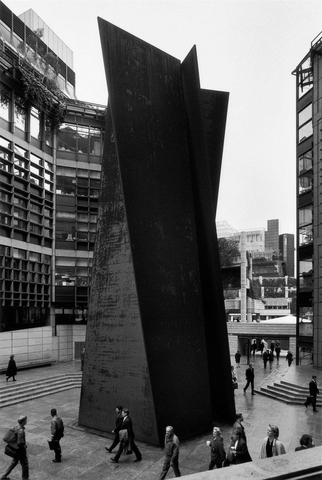 A sculpture by Richard Serra made of five trapezoidal steel slabs, titled Fulcrum, dated 1986-87.